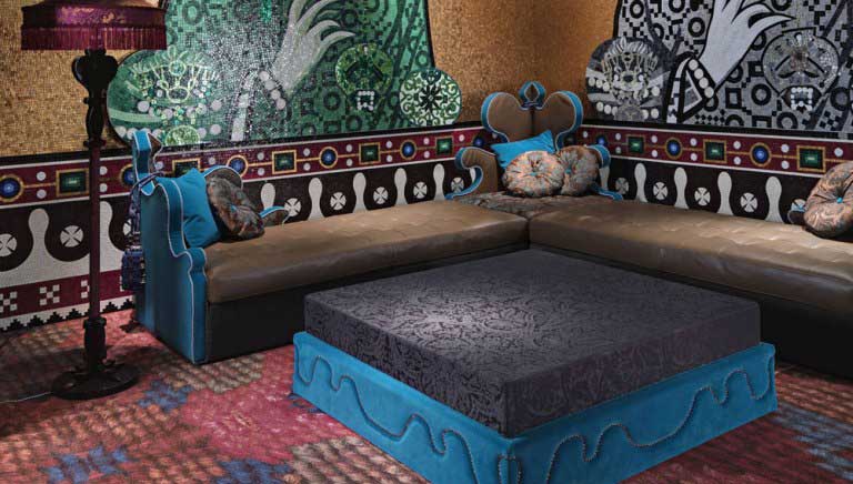 blue_and_brown_living_room_furniture_with_mosaic_wall_design.jpg