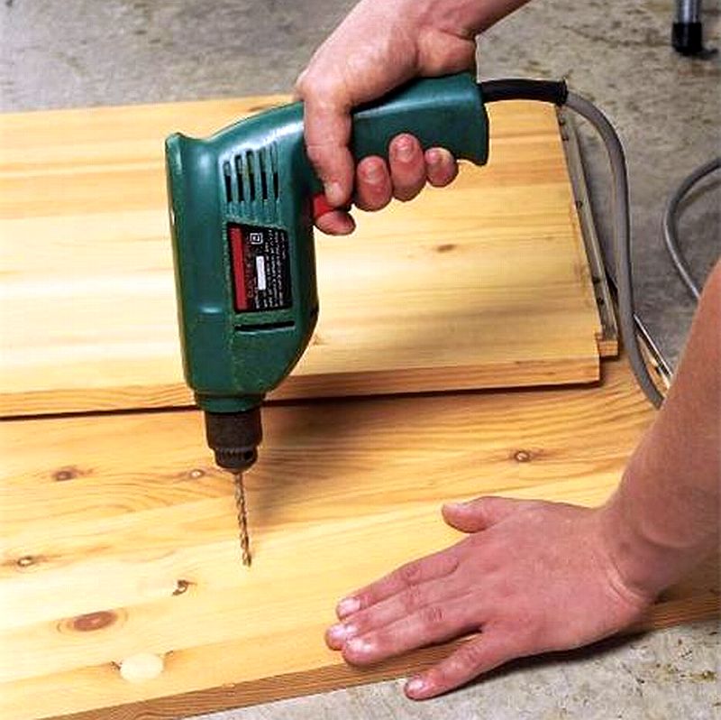 mans_hand_using_electric_drill_to_drill_wood_pls_00003123_001.jpg