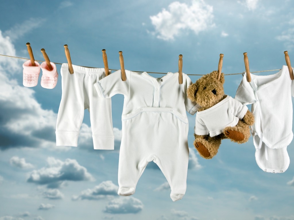 cute_teddy_bear_hanging_outside_between_baby_laundry.jpg
